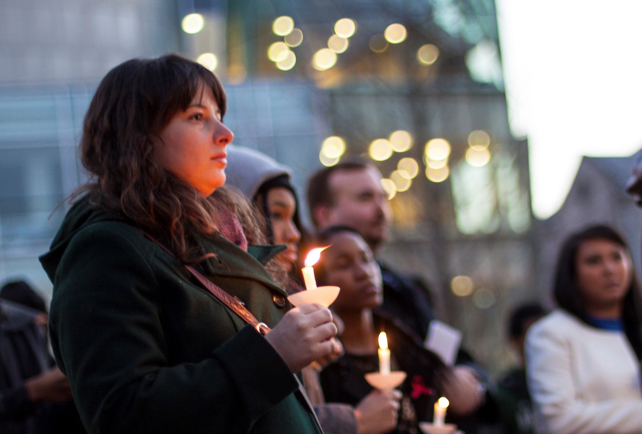 University of Baltimore Students  holding candle